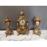 Decorative three piece brass and ceramic clock garniture