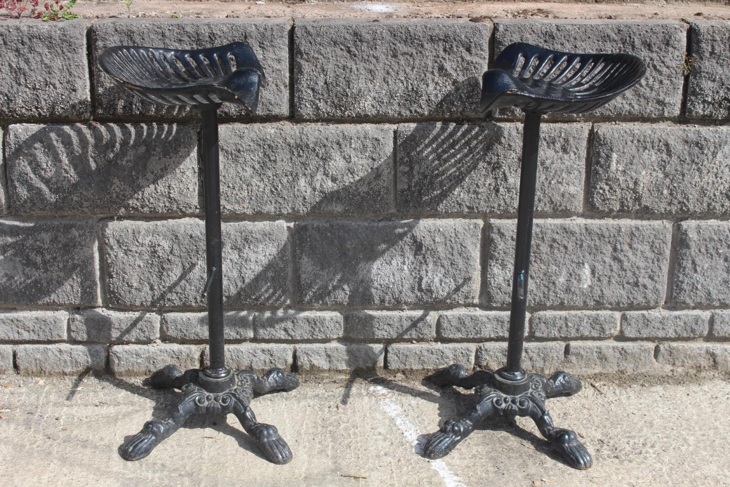 Pair of cast iron bar stools