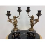 Pair of Gilded Bronze & Black Floral Cherub Candelabra.