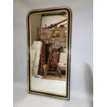 19th. C. ebonised and gilt wall mirror.