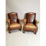 Pair of leather upholstered armchairs