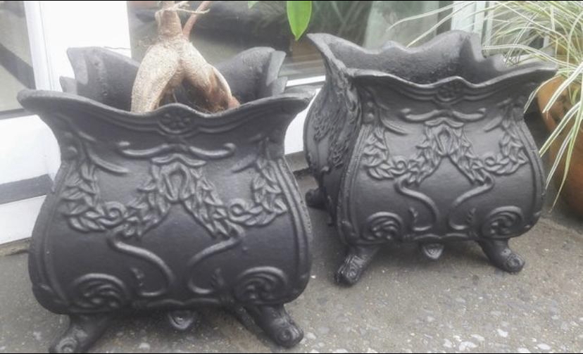 Pair of cast iron planters.