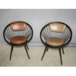 Near pair of stylish circular framed chairs with leather upholstery 28 W x 31 H x 22 D