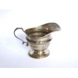 Plain U shape silver milk jug with reeded girdle design on pedestal base. Birmingham 1914 by