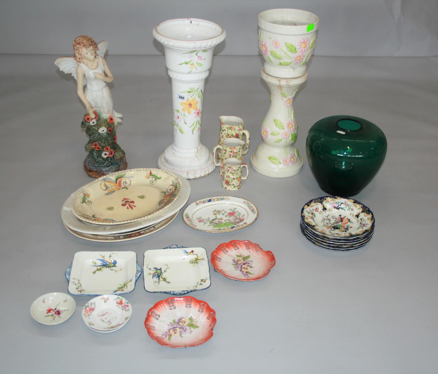 Ceramic jardinière on stand, ceramic fairy, large green glass bowl, collection of platters and 40