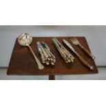 Set of Kings pattern knives, ladle, and silver mounted bone and silver knife and fork.