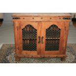 Unusual two door cabinet with metal grilles and bindings. 100W x 90H x 46D