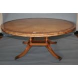 Superb quality circular dining table with radiating burr veneer cross banded in rosewood, standing