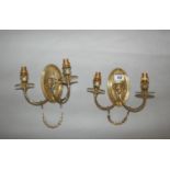 Pair of quality Edwardian two branch wall sconces with rams head decoration.