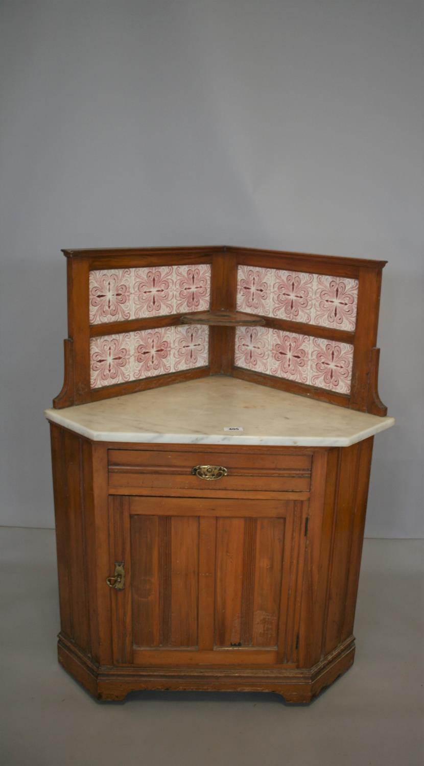 Unusual Art Nouveau walnut corner wash stand with tiled back and marble top. 93W x 122H x 67H