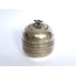 Circular white metal trinket box and cover with flower finial. Diameter: 2 ¾”