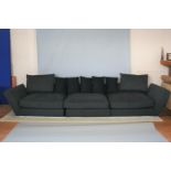 B & B Italia sofa of large proportion, standing on chrome base. 370W x 9H x 120 D