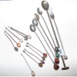 Set of cocktail sticks with coffee bean decoration and cocktail spoons.