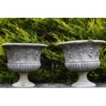 Pair of sandstone planters with figural decoration on circular bases 77W 69H
