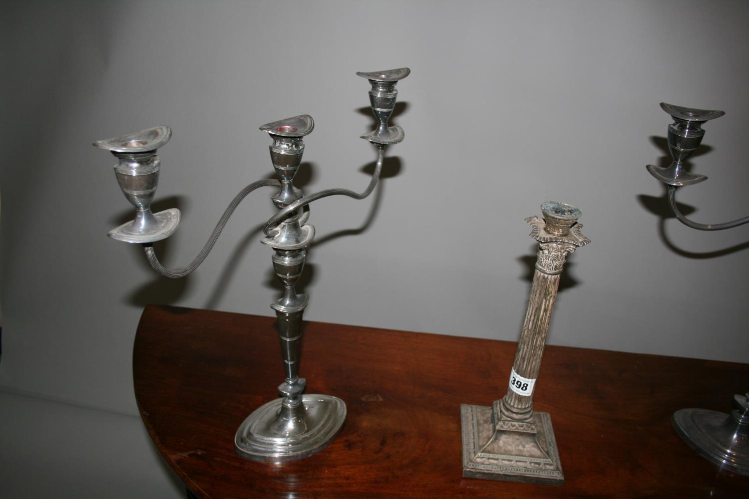 West & Son, Dublin, silver plated lamp base and a pair of candle sticks. - Image 2 of 3