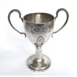 Georgian Irish silver two handle bright cut cup Height: 7 ¾”. Weight: 13ozs. Dublin 1806 by