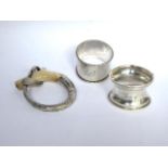 Two silver napkin rings, one Dublin and one Birmingham and a silver and mother of pearl handle.