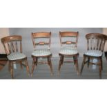 Four kitchen chairs complete with cushions. 46W x 90H x 50D