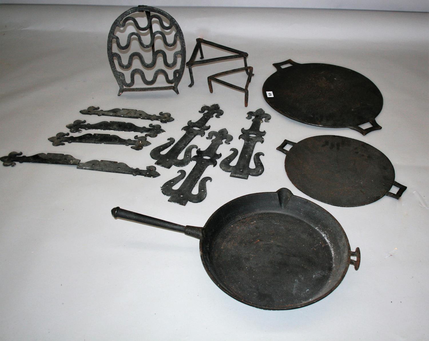 Collection of antique wrought iron and kitchen paraphernalia.