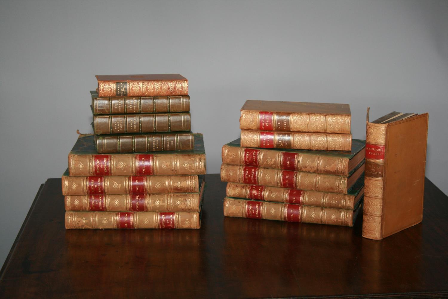 Selection of antique leather bound books, including the history of England.