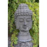 Stone Thai Goddess head on circular base. 18W 45H
