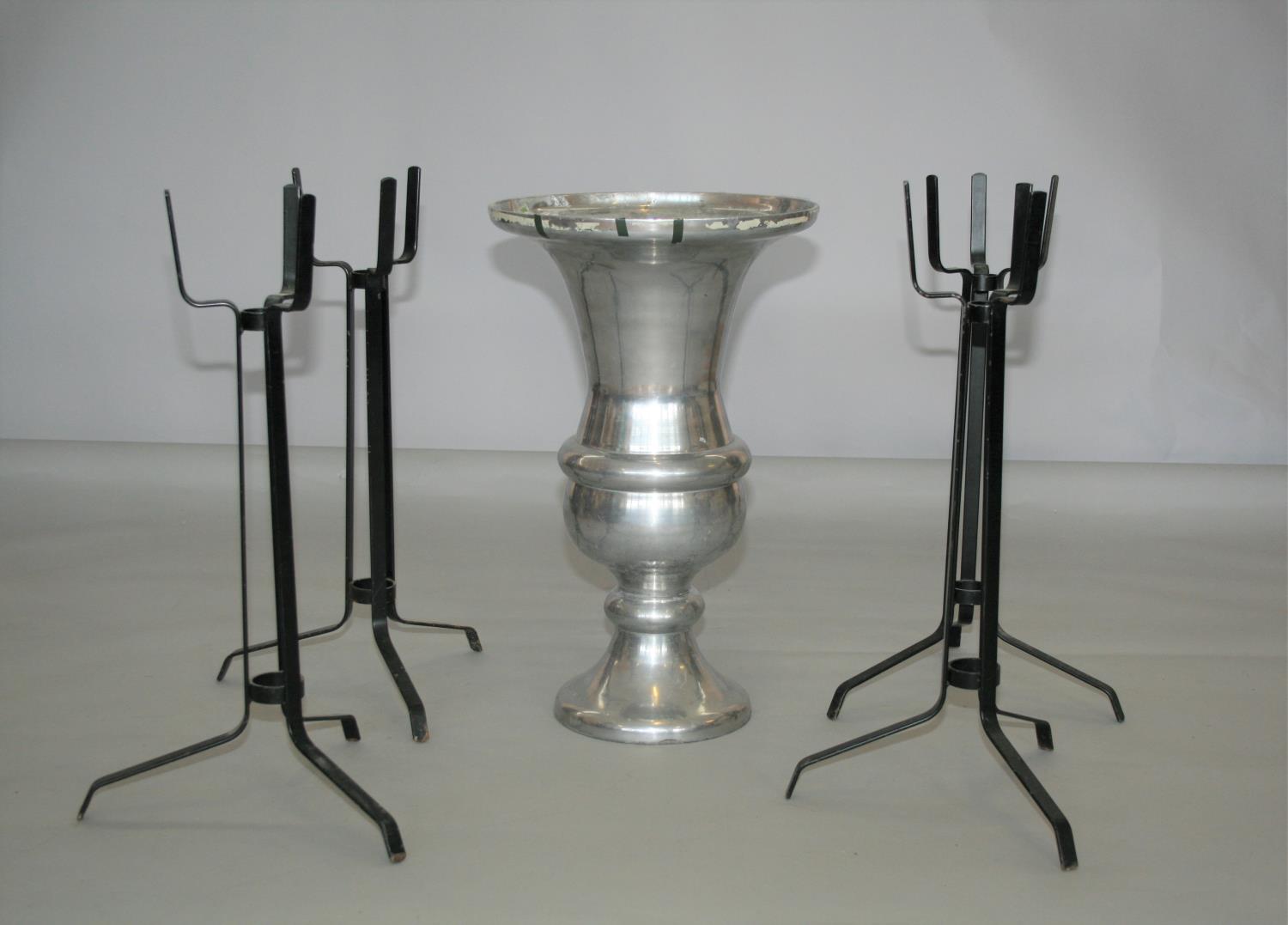 Chrome urn shaped vase (40W x 65H) and four black candle stand.