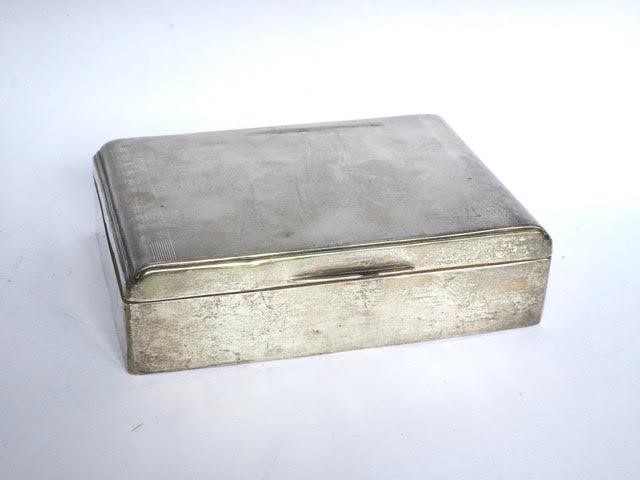 Art Deco silver engine turned design cigarette box. Measurements: 6 ½” X 4 ½”. Sheffield 1936