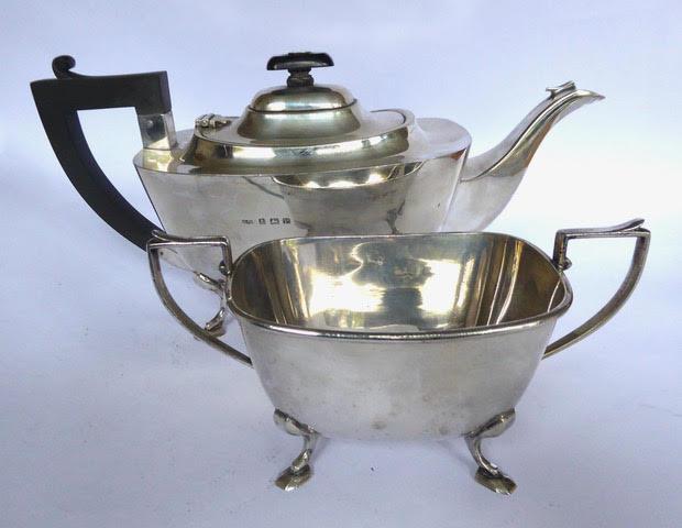 Plain rectangular silver teapot, with Bakelite handle and finial, and matching silver sugar bowl, on