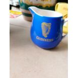 Guinness ceramic advertising jug.