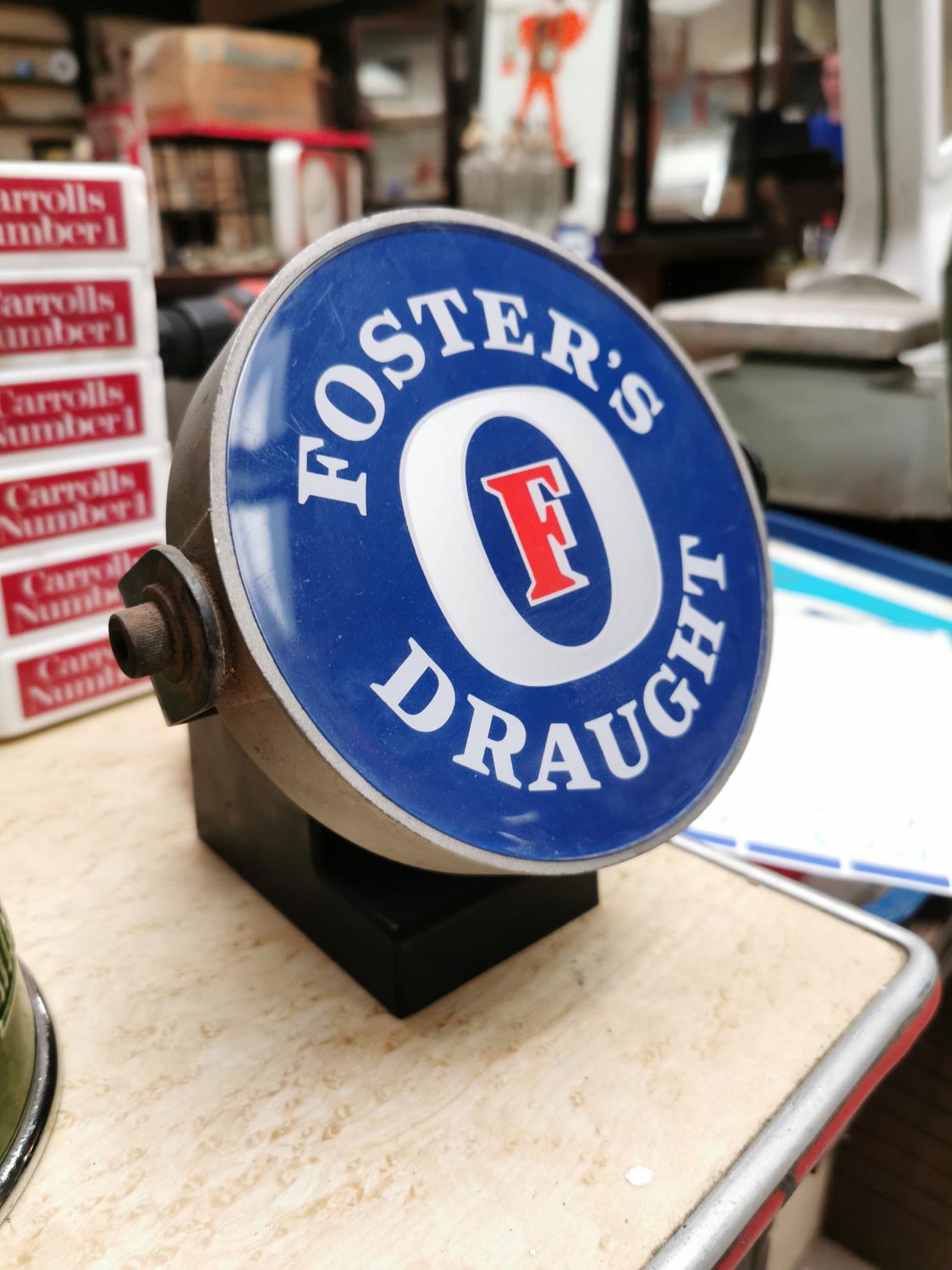 Fosters light up advertising sign.