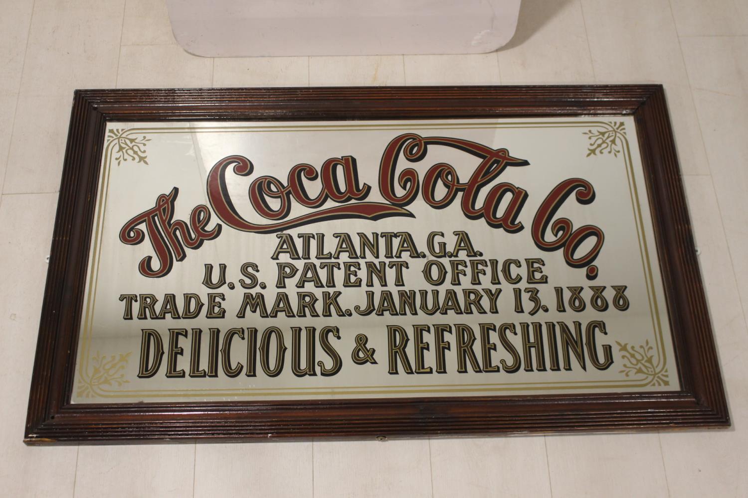 The Coca Cola Co. advertising mirror.