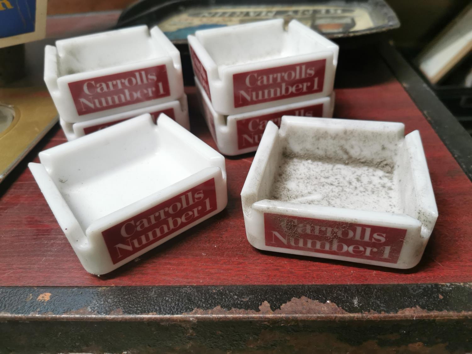 Six Carrolls No. 1 advertising ashtrays.