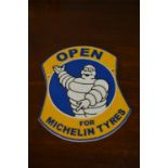 Open for Michelin Tyres advertising sign.