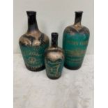 Three French green glass wine bottles