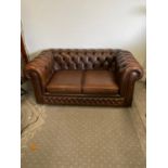 Leather Chesterfield two seater sofa.