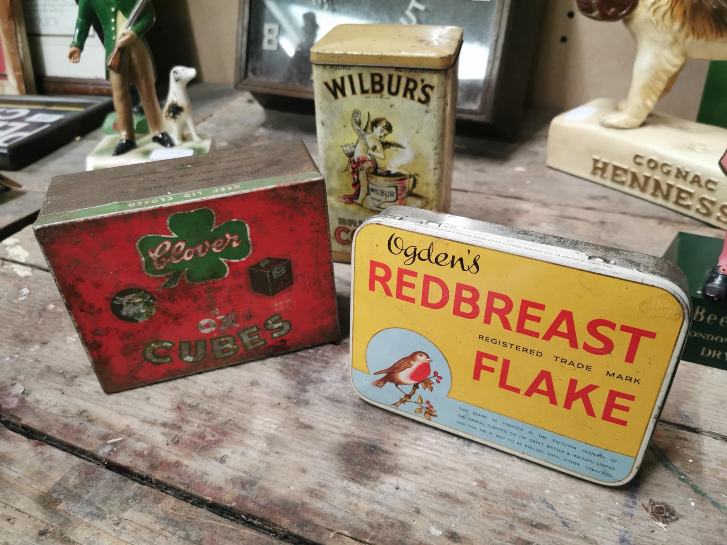 Three advertising tins.