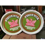 Two Phoenix draught beer advertising trays.