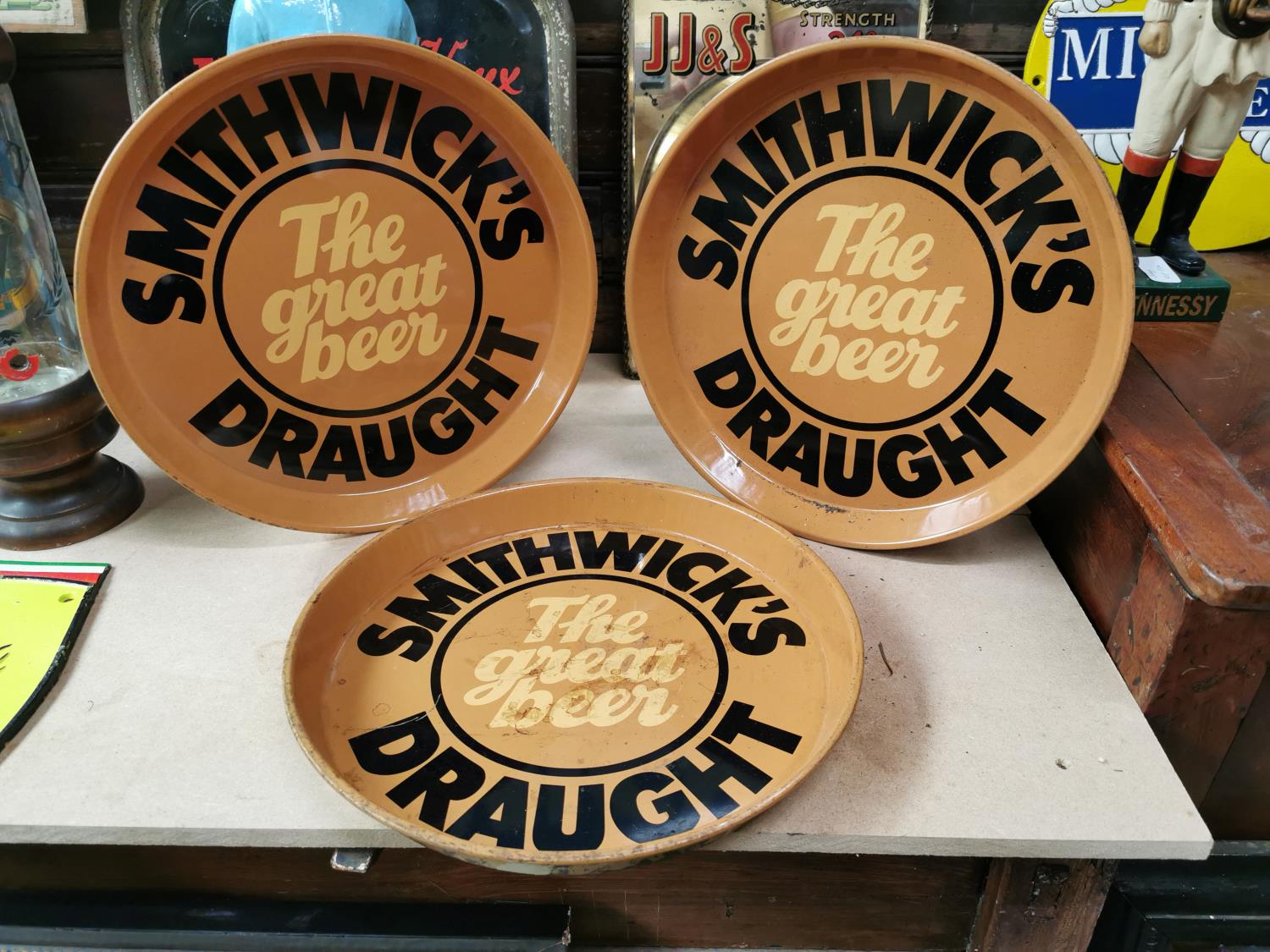 Three Smithwick's Draught advertising trays.