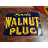 Smoke Walnut Plug advertising sign.