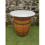 Oak metal bound whiskey barrel table.