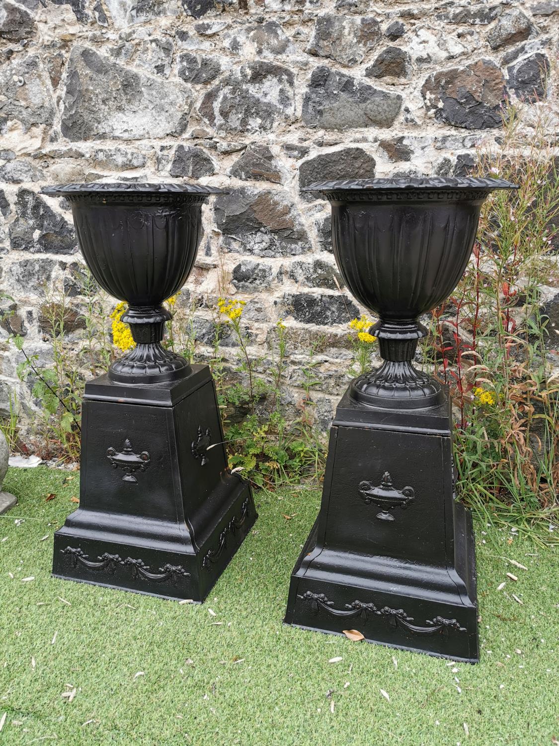 Pair of good quality cast iron urns.