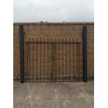 Set of wrought iron gates and matching pillars.