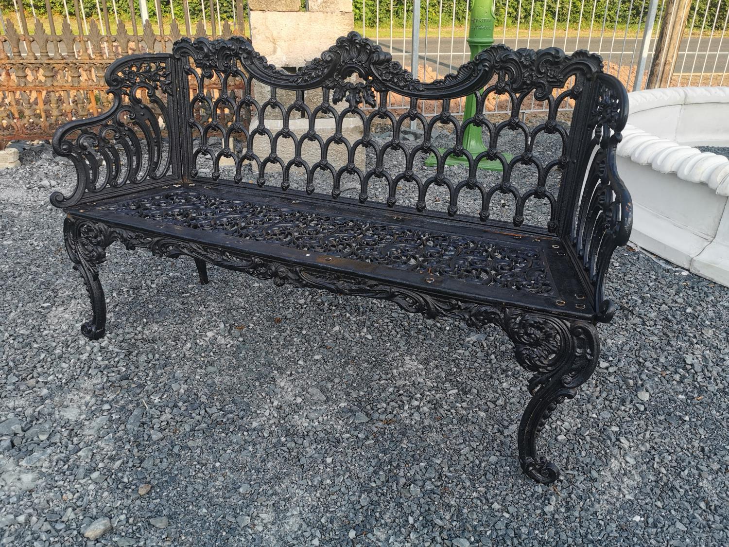 Decorative cast iron garden bench in the Rococo style