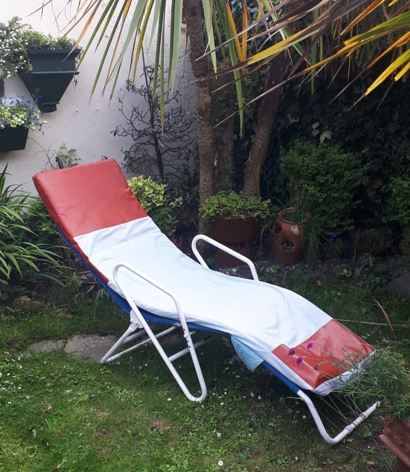 Retro metal garden recliner.