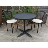 Round café table and two chairs.