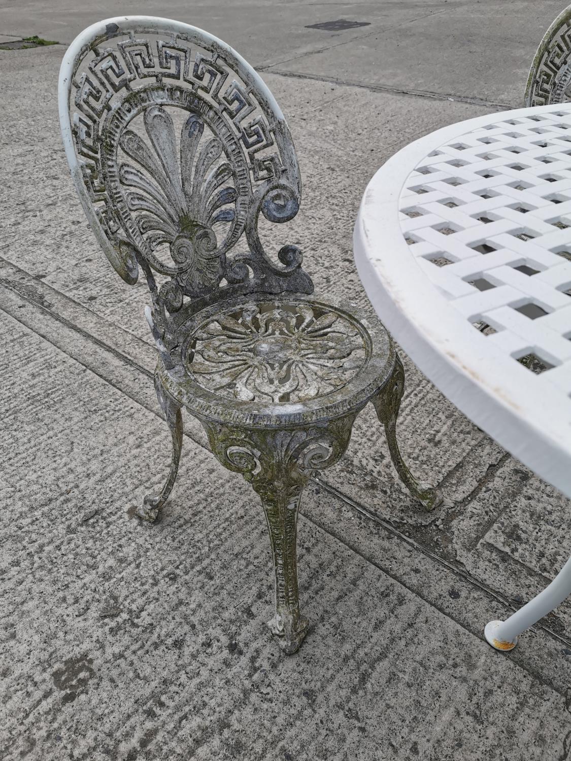 Cast iron garden table and four chairs - Image 2 of 3