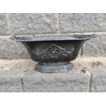 Decorative cast iron planter.