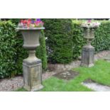 Pair of stone fluted urns