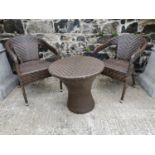 Rattan garden table and two chairs.