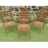 Set of four wrought iron and bamboo garden chairs.